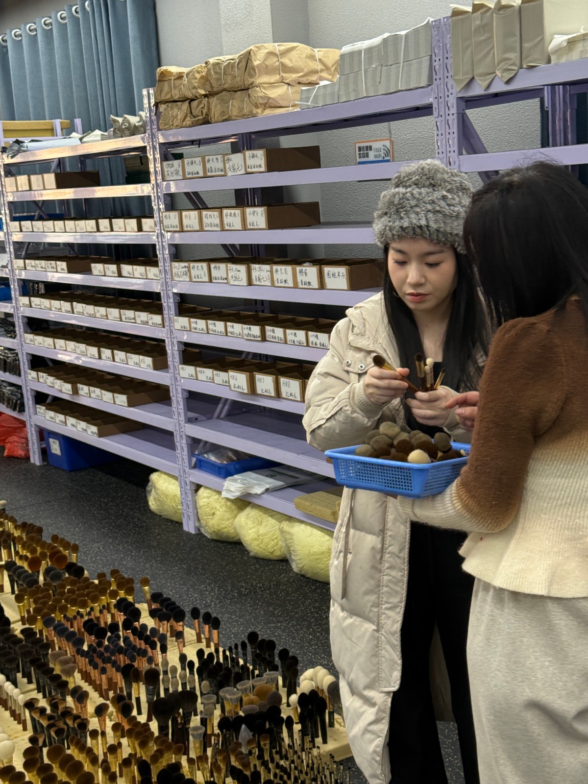 Vivien selecting premium bristles at factory